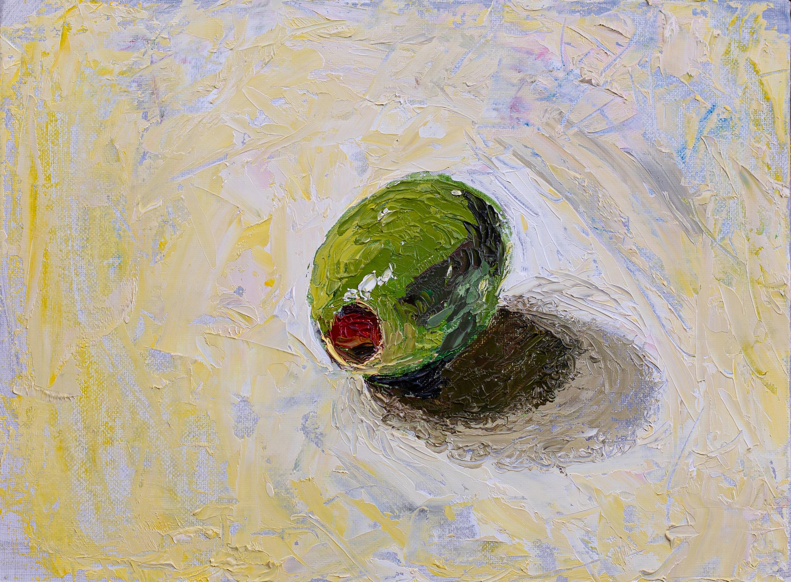 Thick oil painting of a single green olive with a red pimento casting a shadow on a textured lavender and yellow surface.